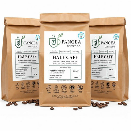 Pangea Half Caff 3-pack — three 10oz bags of low acid, mold-free half caffeine medium roast coffee on a white background