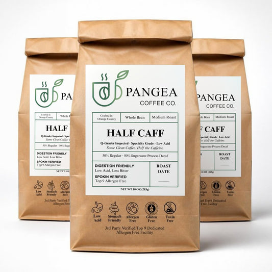 Pangea Half Caff 3-pack — three 10oz bags of low acid, mold-free half caffeine medium roast coffee on a white background