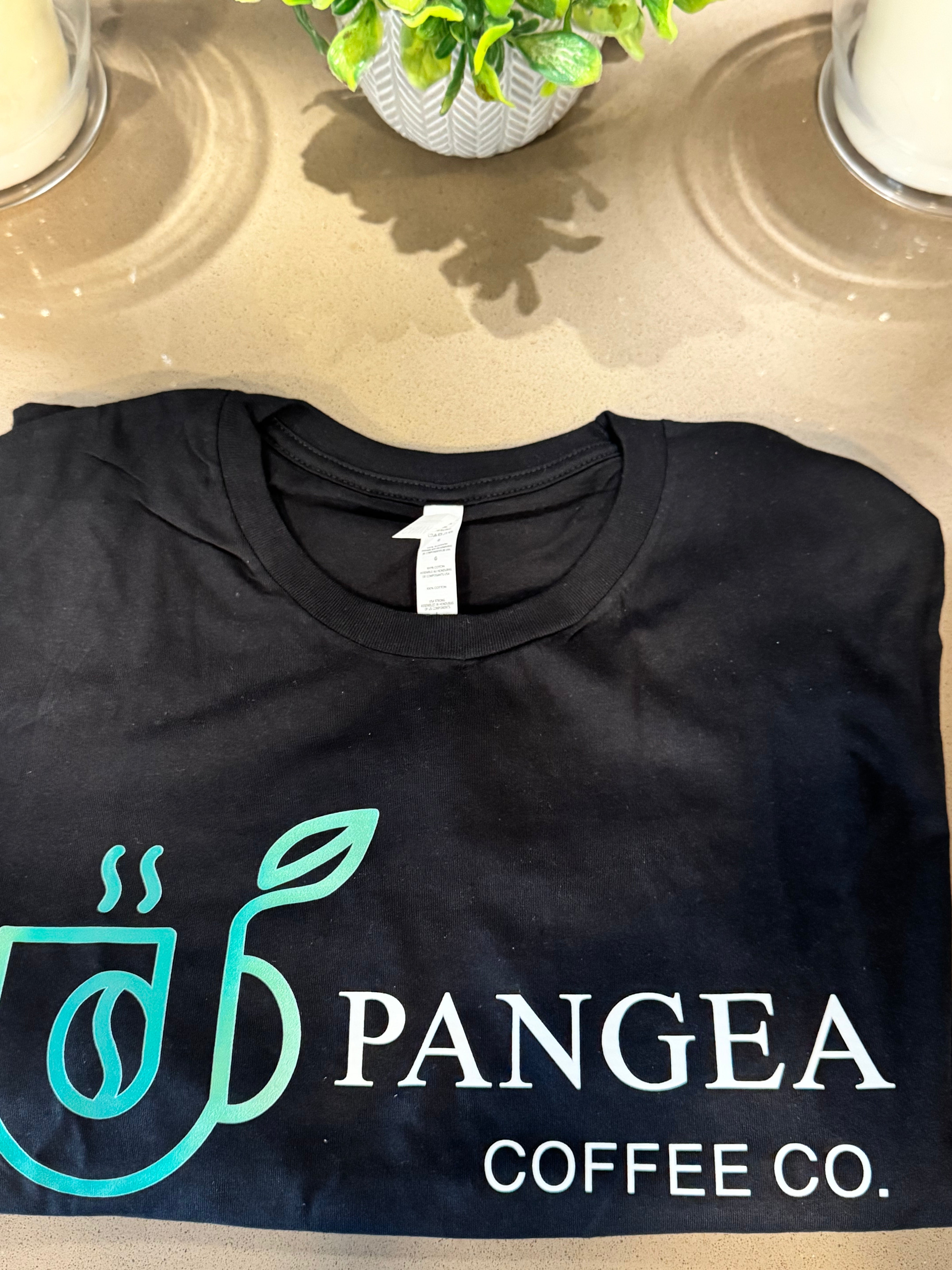 Close-up of Pangea Coffee Co. logo on black unisex graphic tee