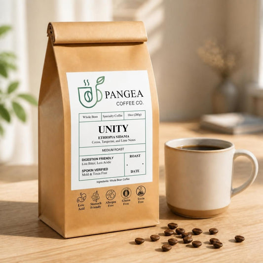 Pangea Unity Ethiopia Sidama low acid medium roast coffee, 10oz bag beside a mug, cocoa, tangerine and lime notes, mold-free
