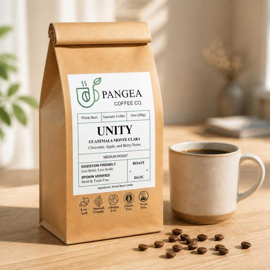 Pangea Unity Guatemala Monte Clara low acid medium roast coffee, 10oz bag beside a mug, chocolate, apple and berry notes, mold-free