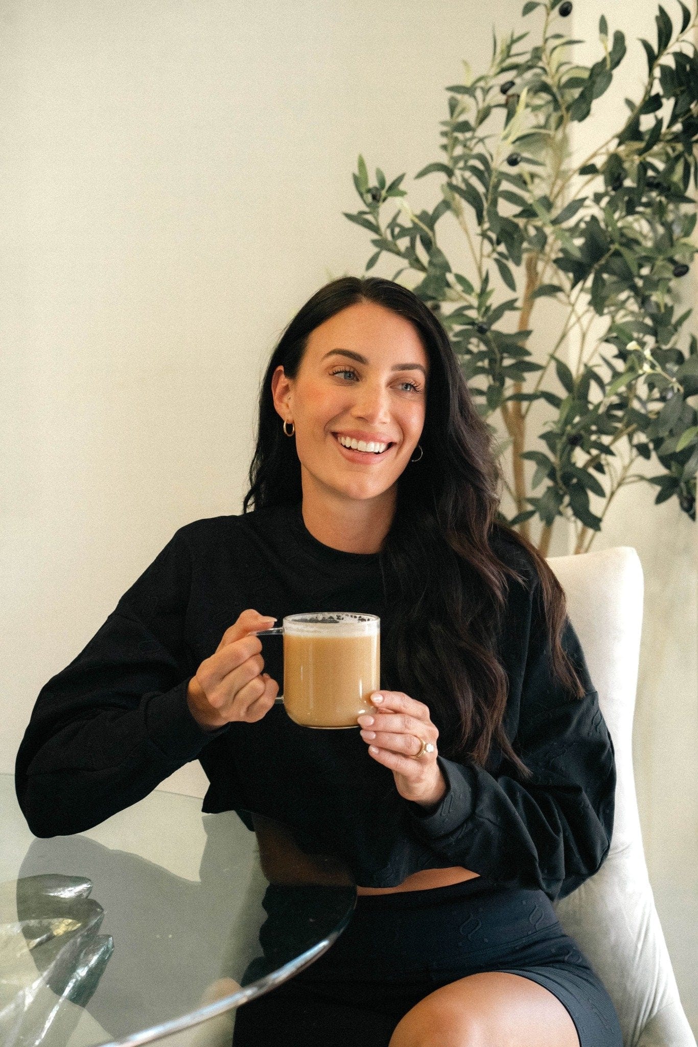 Woman enjoying Bold Respect low acid espresso without heartburn or acid reflux - stomach friendly coffee