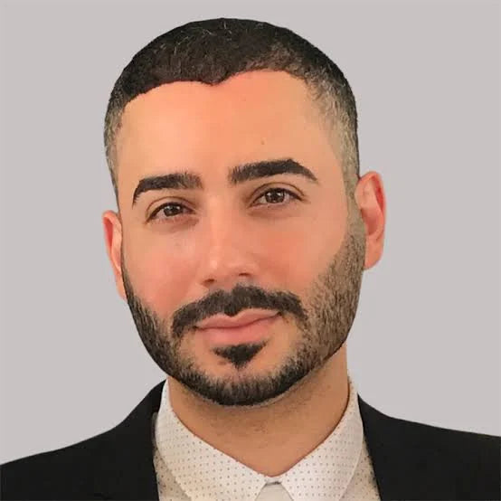 Dr. Joseph Salhab, DO, board-certified gastroenterologist and Pangea co-founder, in a suit