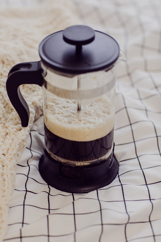 French press coffee maker with fresh brewed low acid coffee